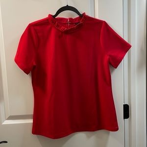 Red blouse with ruffled collar